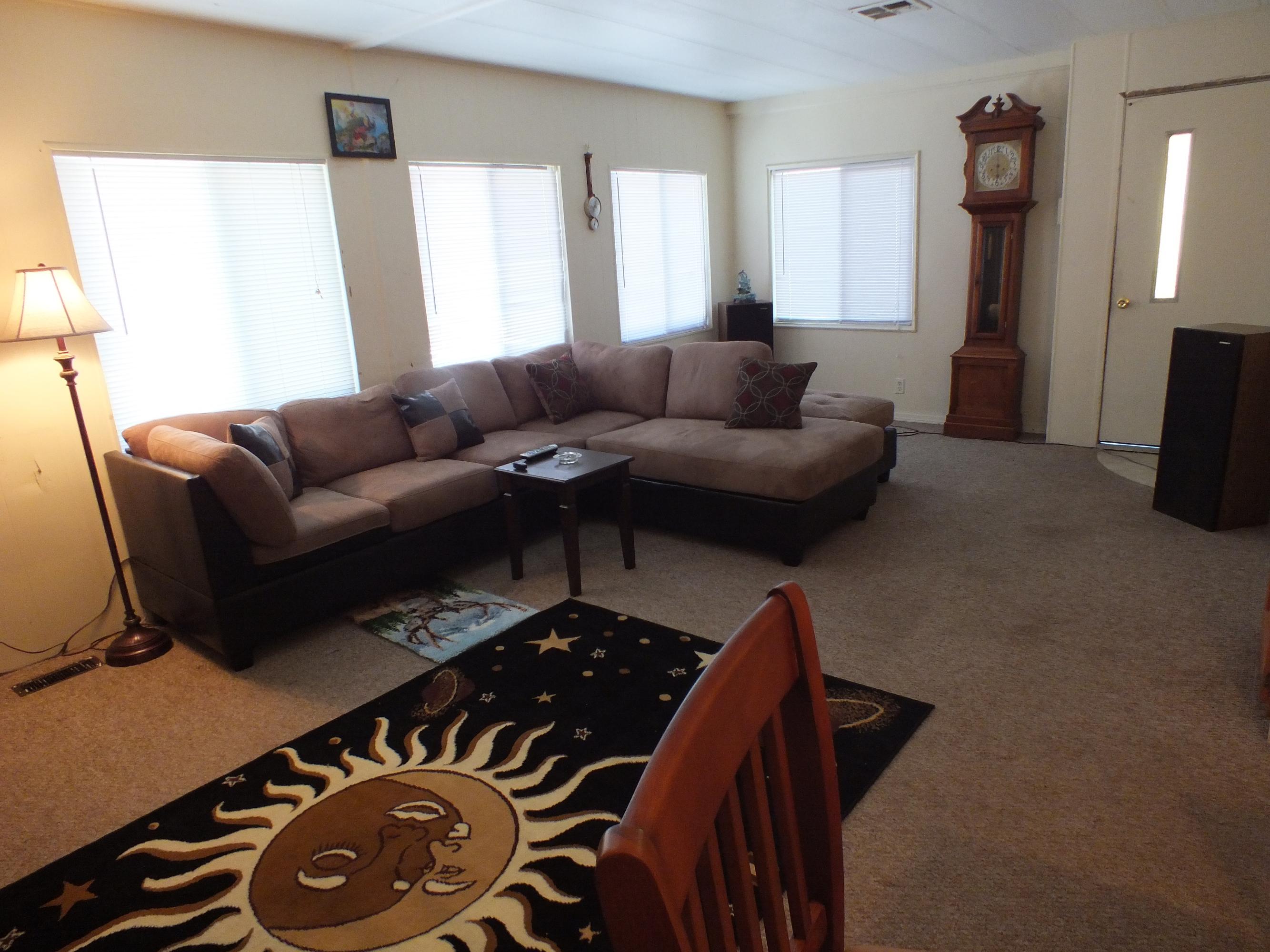 7725 Happy Valley Road, Unit DELUXE Anderson, CA 96007 - Photo 16 of 29 a living room with furniture and a window