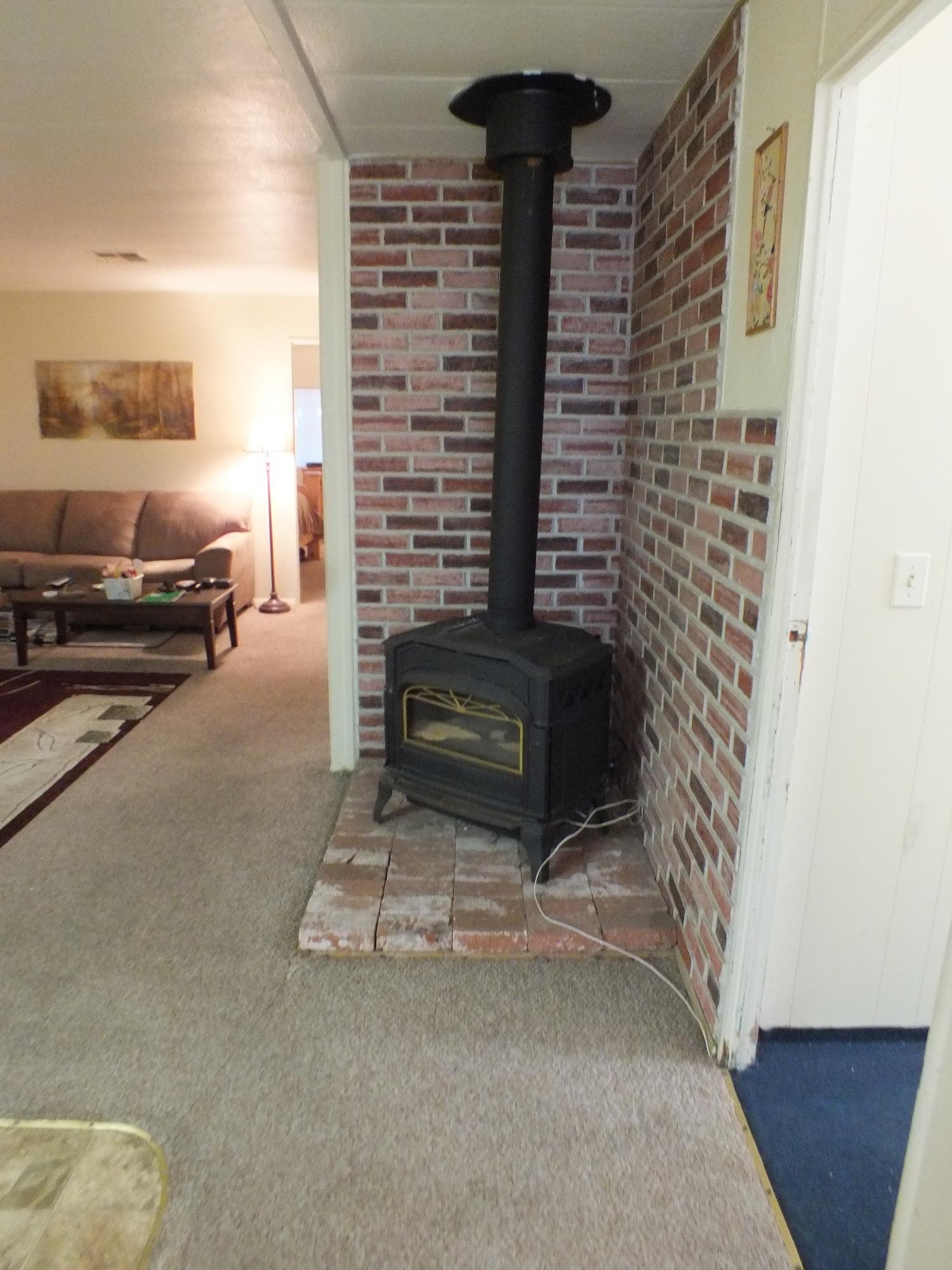 7725 Happy Valley Road, Unit DELUXE Anderson, CA 96007 - Photo 17 of 29 a view of living room with furniture and a fireplace