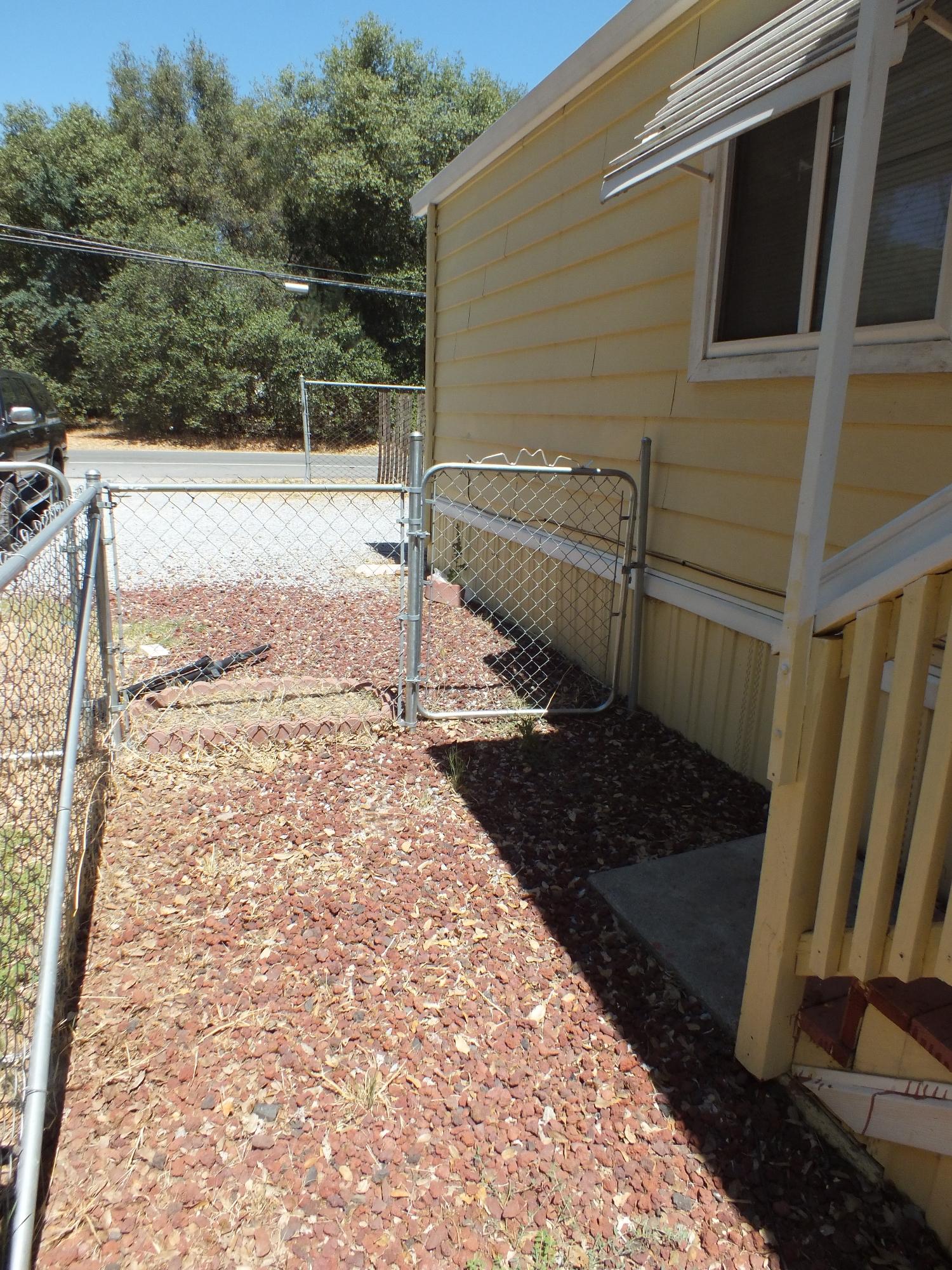 7725 Happy Valley Road, Unit DELUXE Anderson, CA 96007 - Photo 2 of 29 a view of a backyard of the house