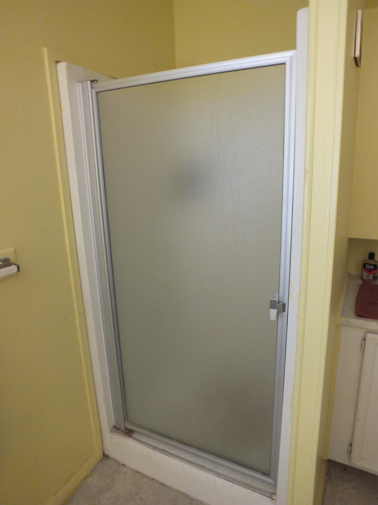 7725 Happy Valley Road, Unit DELUXE Anderson, CA 96007 - Photo 26 of 29 a bathroom with a glass shower door