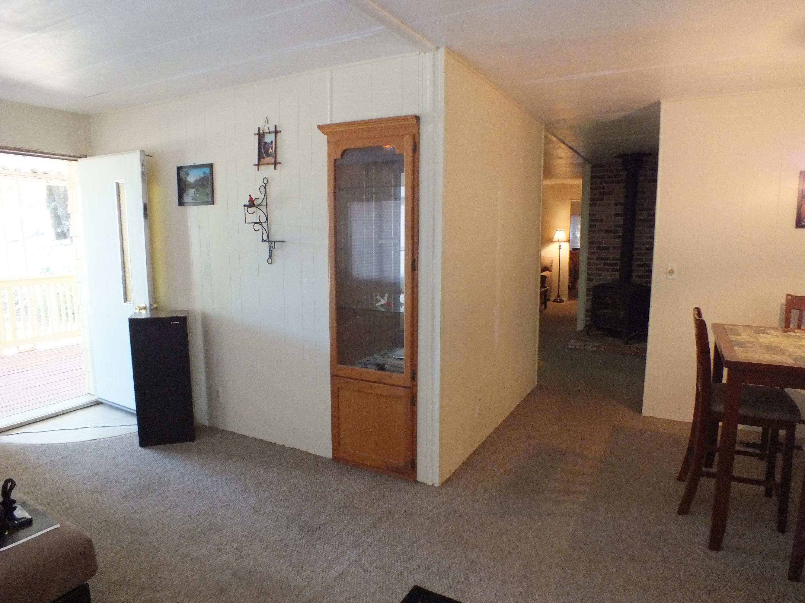 7725 Happy Valley Road, Unit DELUXE Anderson, CA 96007 - Photo 28 of 29 a view of a livingroom with furniture and an empty room