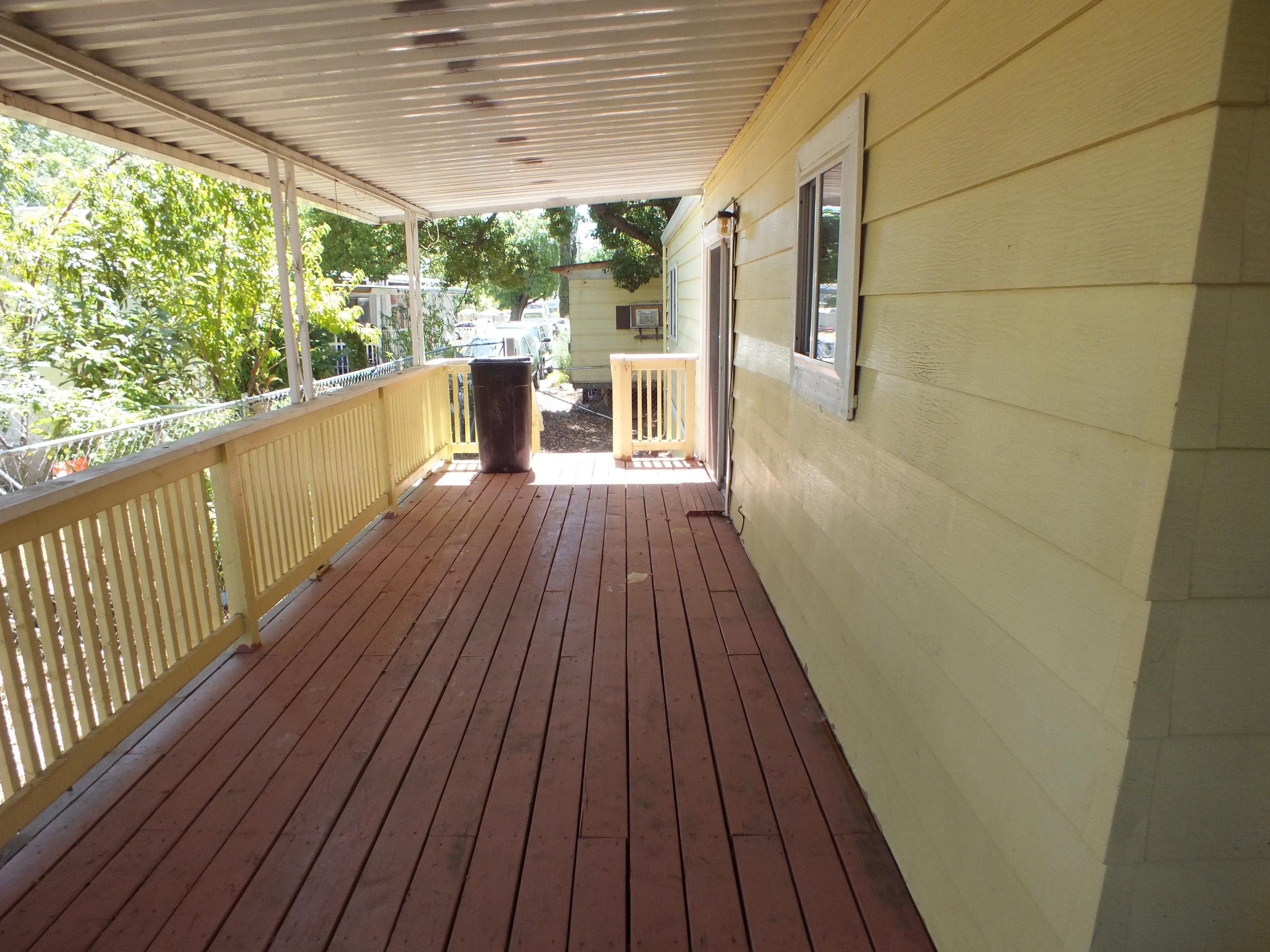 7725 Happy Valley Road, Unit DELUXE Anderson, CA 96007 - Photo 29 of 29 a view of balcony with wooden floor