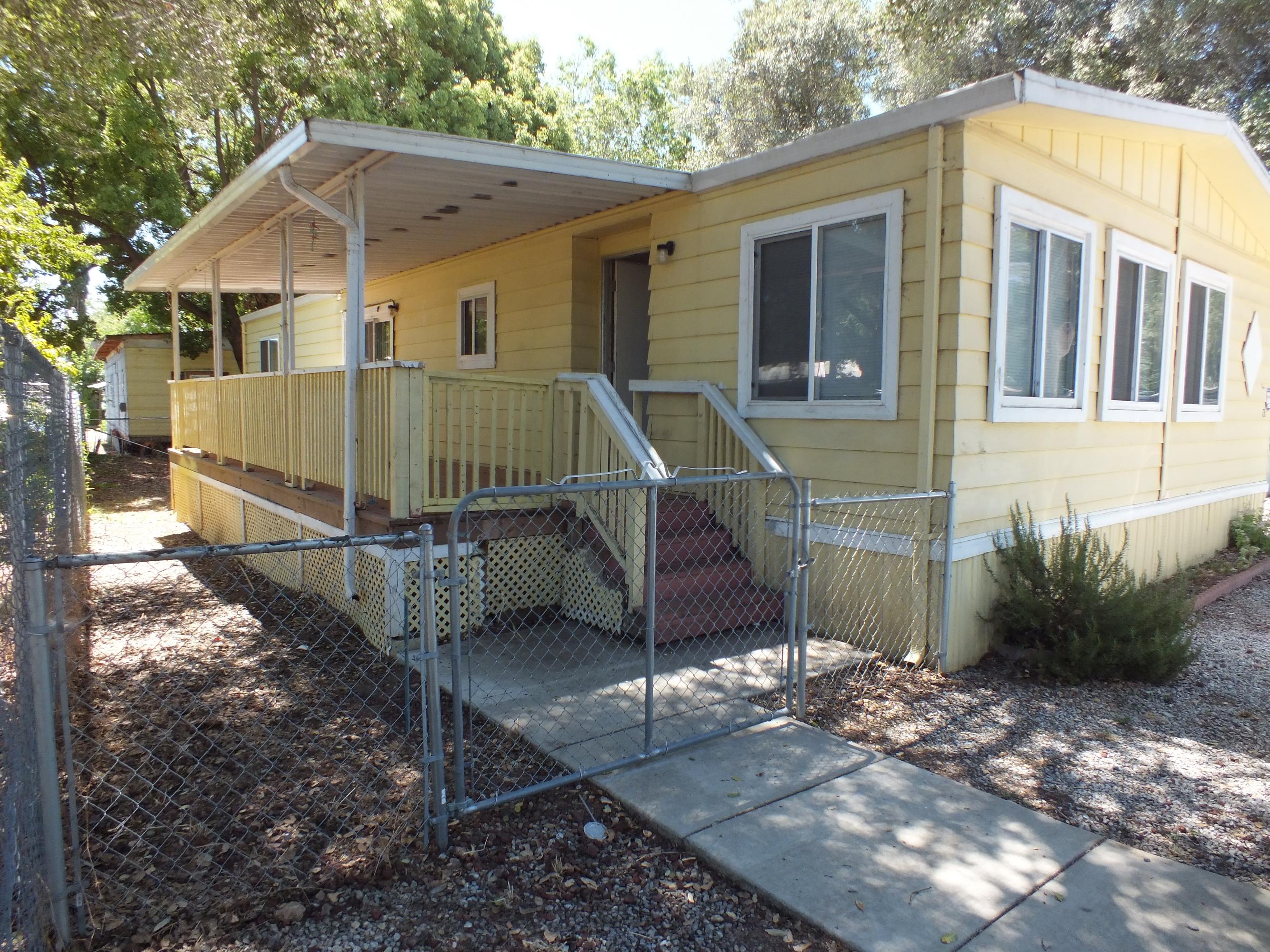 7725 Happy Valley Road, Unit DELUXE Anderson, CA 96007 - Photo 7 of 29 a front view of a house with garden