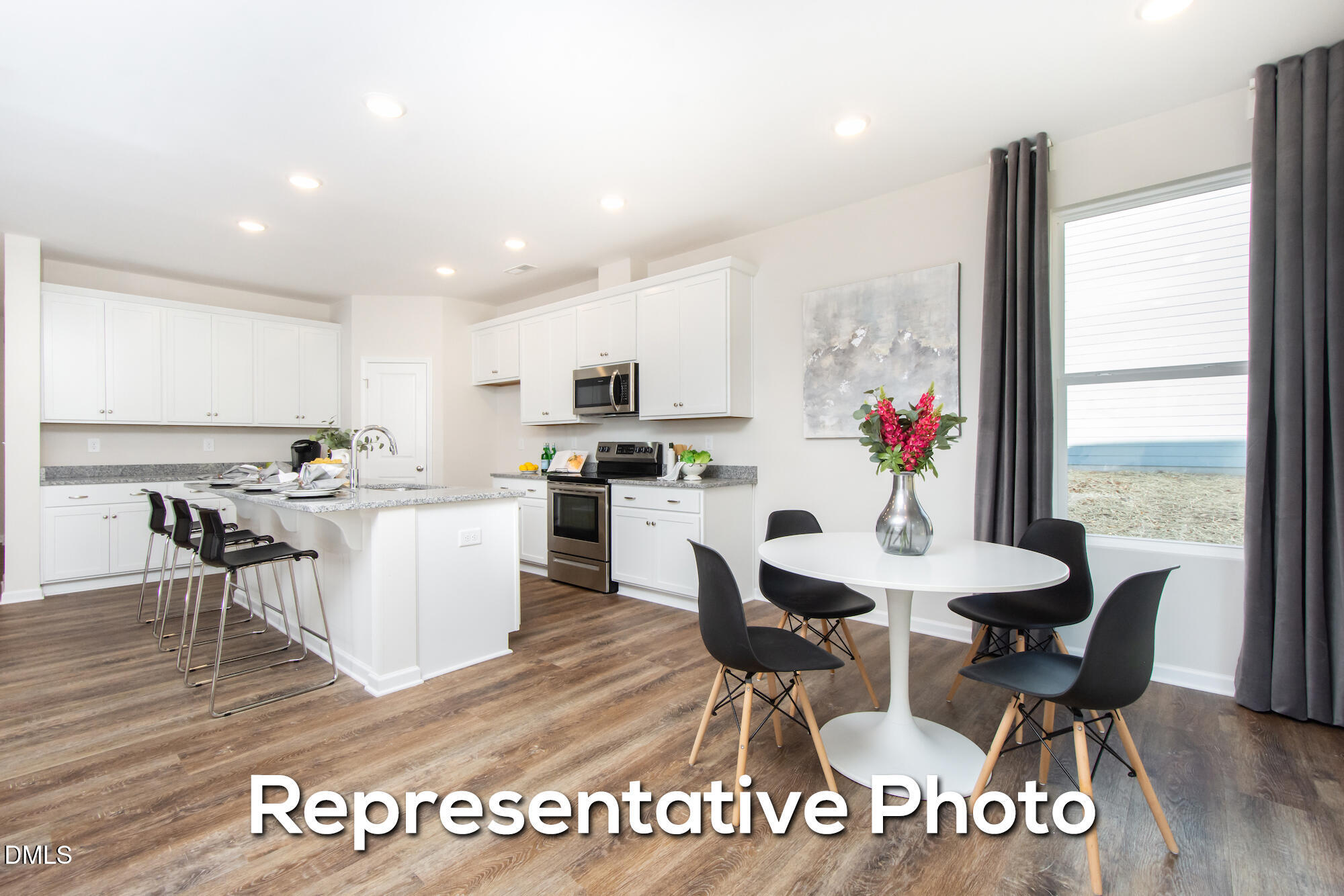 29 H River Meadow Spring Hope, NC 27882 - Photo 6 of 20 a view of a dining room with furniture window and wooden floor