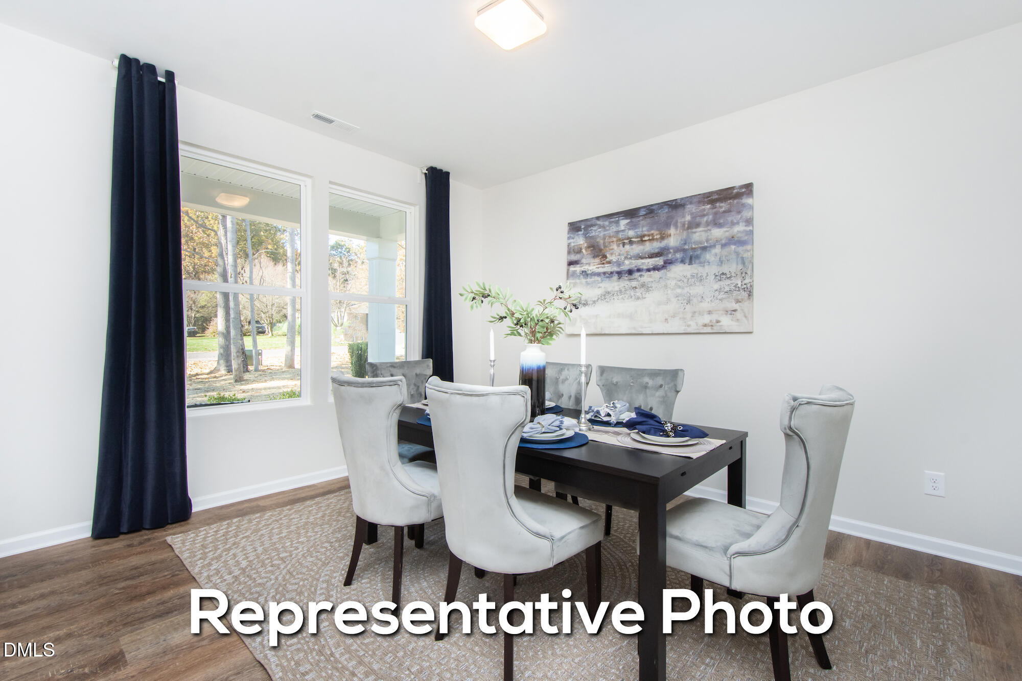 29 H River Meadow Spring Hope, NC 27882 - Photo 7 of 20 a view of a dining room with furniture window and wooden floor