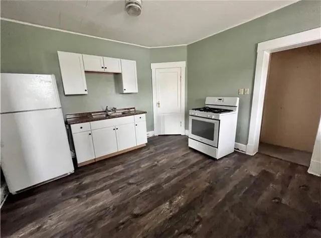 a kitchen with a sink and a stove