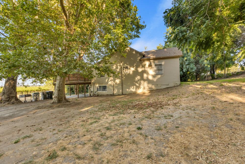 53140 South River Road Clarksburg, CA 95612 - Photo 16 of 66 a front view of a house with a yard and trees