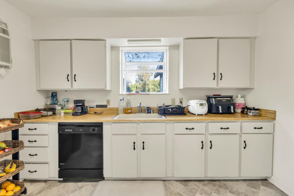 53140 South River Road Clarksburg, CA 95612 - Photo 33 of 66 a kitchen with cabinets appliances a sink and a window