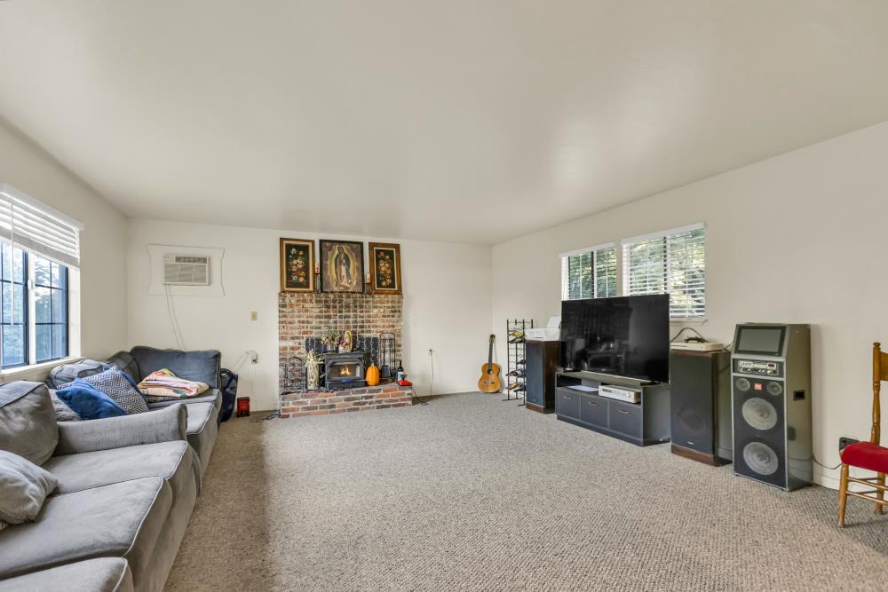 53140 South River Road Clarksburg, CA 95612 - Photo 34 of 66 a living room with furniture and a flat screen tv