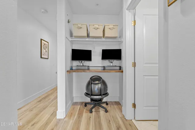 a view of a hallway with washer and dryer
