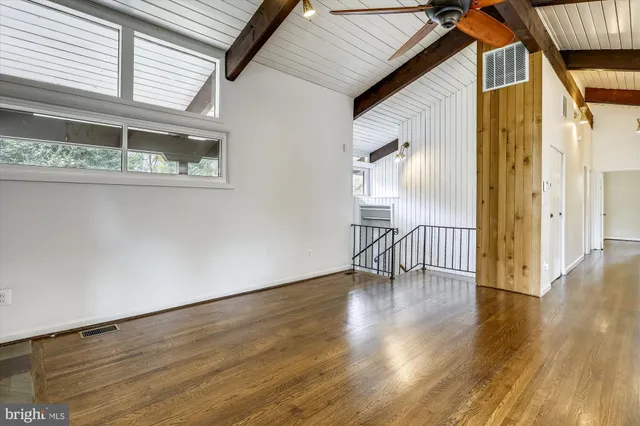 a view of an entryway with wooden floor