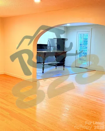 a roof deck with table and chairs and potted plants