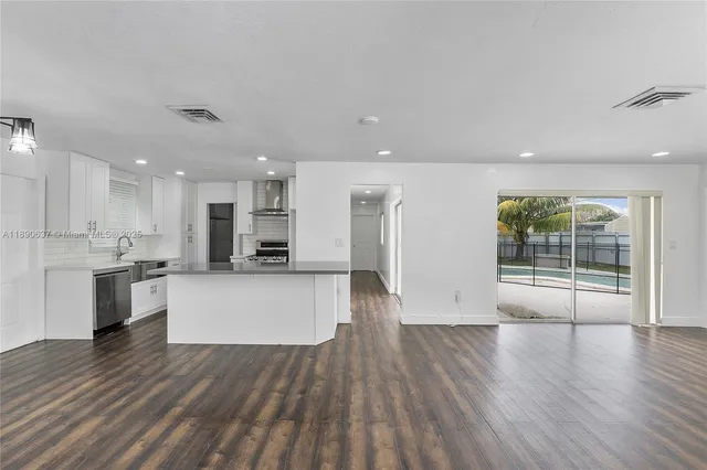 a view of kitchen with wooden floor and window