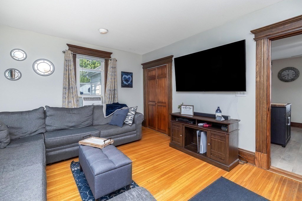 105 Pine Street West Springfield, MA 01089 - Photo 12 of 35 a living room with furniture and a flat screen tv