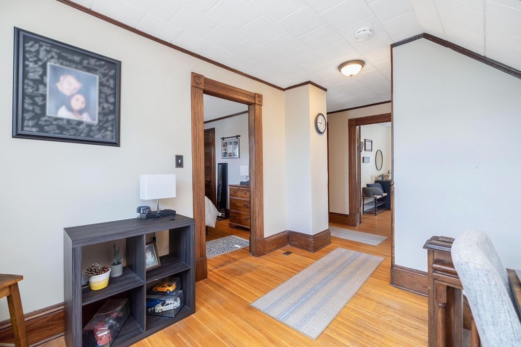 105 Pine Street West Springfield, MA 01089 - Photo 15 of 35 a bedroom with furniture and a wooden floor