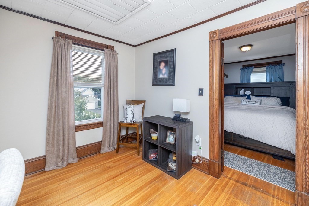 105 Pine Street West Springfield, MA 01089 - Photo 17 of 35 a bedroom with furniture and a wooden floor