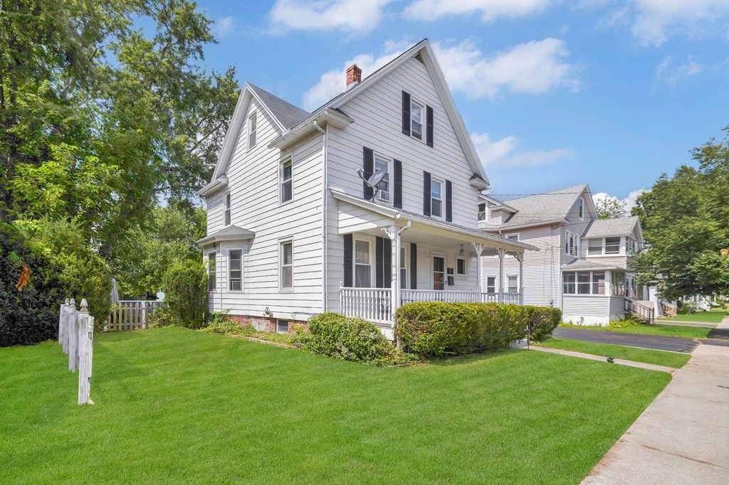 105 Pine Street West Springfield, MA 01089 - Photo 2 of 35 a front view of a house with a yard
