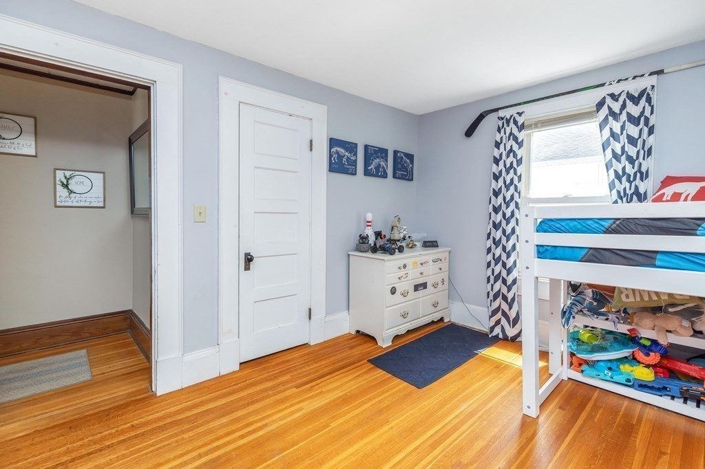 105 Pine Street West Springfield, MA 01089 - Photo 21 of 35 a bedroom with a bed and a dresser in it