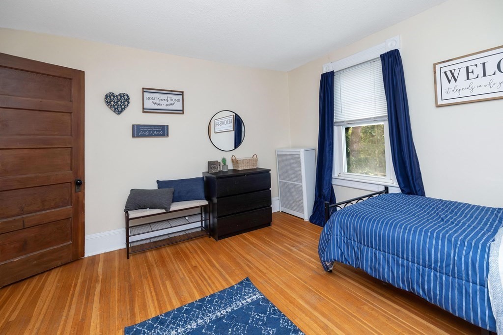 105 Pine Street West Springfield, MA 01089 - Photo 24 of 35 a bedroom with a bed and a window