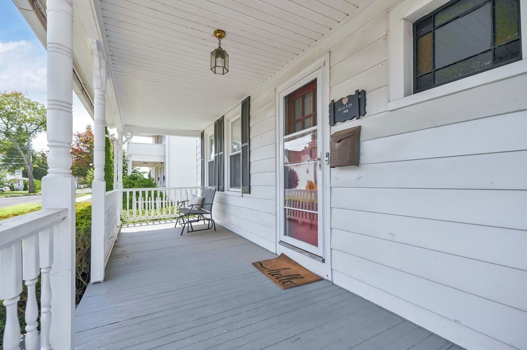 105 Pine Street West Springfield, MA 01089 - Photo 3 of 35 a view of a porch with wooden floor and fence