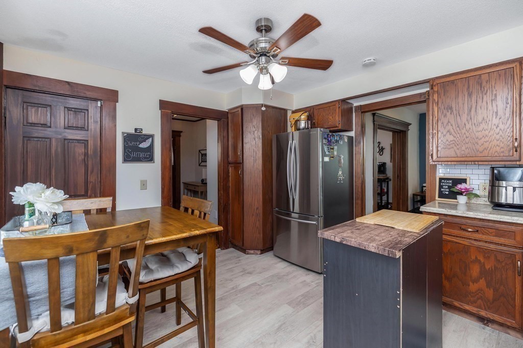 105 Pine Street West Springfield, MA 01089 - Photo 5 of 35 a living room with stainless steel appliances kitchen island granite countertop furniture and a kitchen view