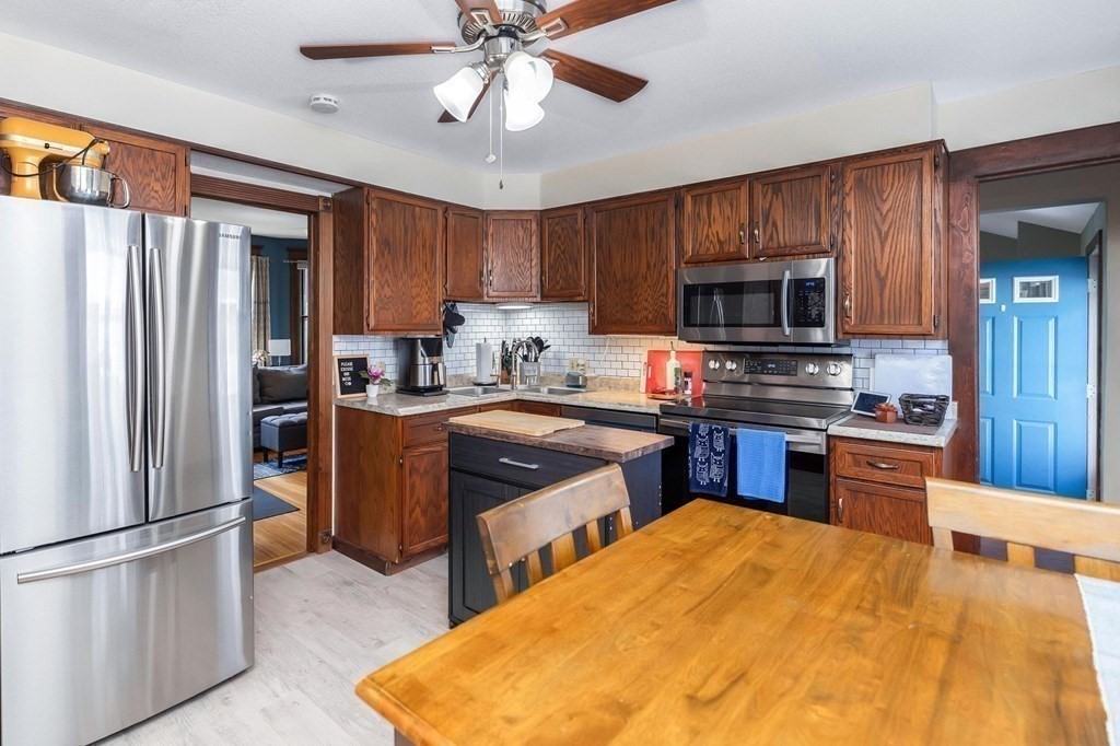 105 Pine Street West Springfield, MA 01089 - Photo 6 of 35 a kitchen with stainless steel appliances granite countertop a refrigerator stove and sink