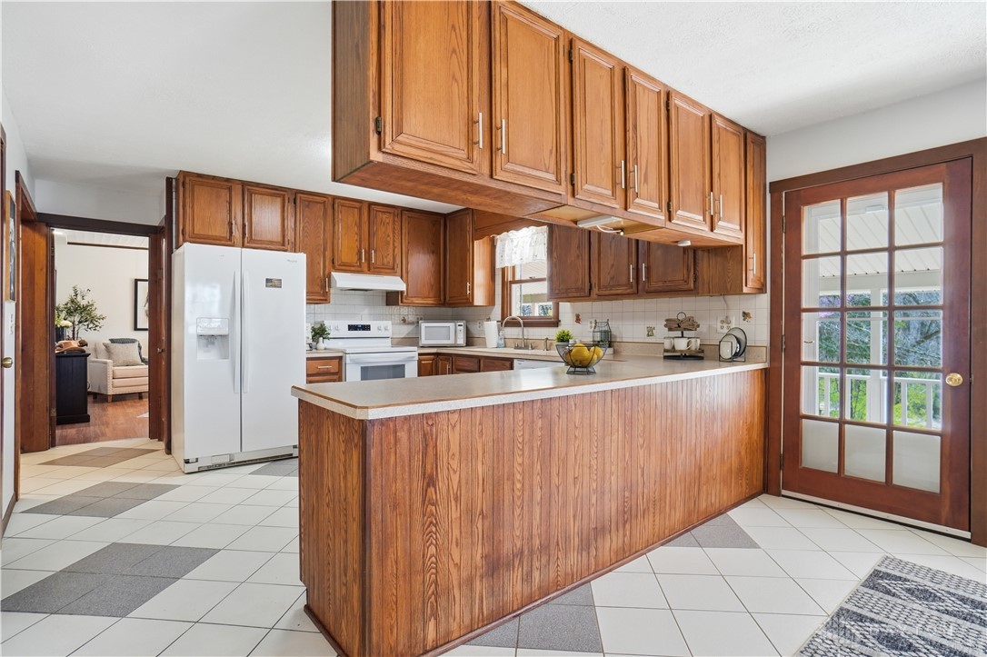 7553 Coffin Station Road Springfield, OH 45502 - Photo 45 of 95 This spacious kitchen offers ample cabinetry and an inviting atmosphere for daily living.
