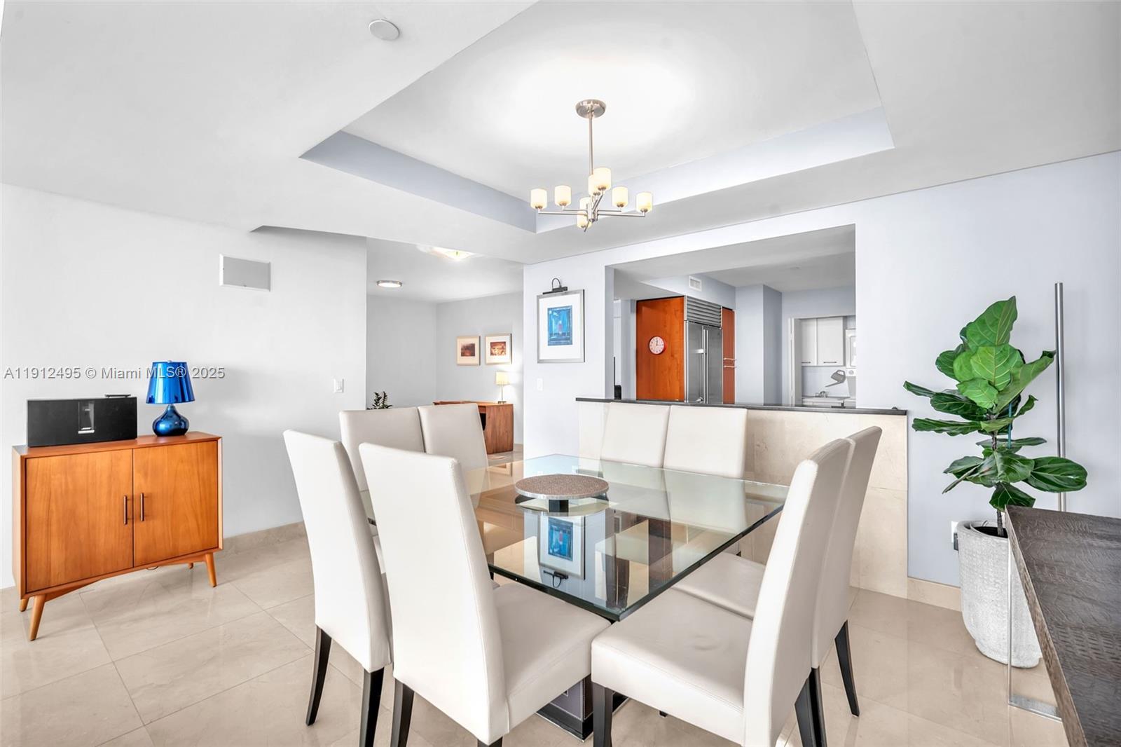 1331 Brickell Bay Drive, Unit 3609 Miami, FL 33131 - Photo 11 of 35 a view of a dining room with furniture and a chandelier