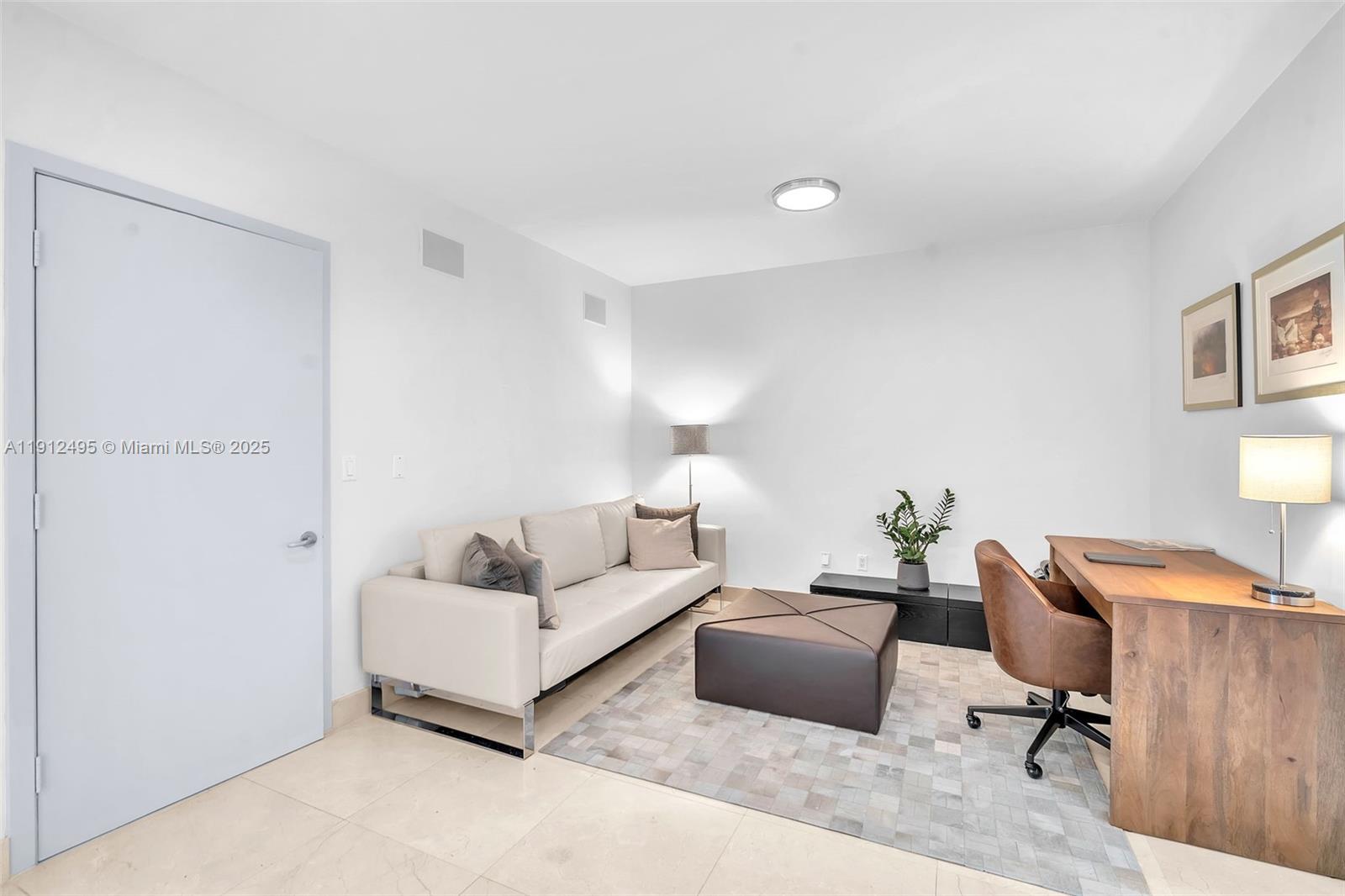 1331 Brickell Bay Drive, Unit 3609 Miami, FL 33131 - Photo 13 of 35 a living room with furniture lamp and a window