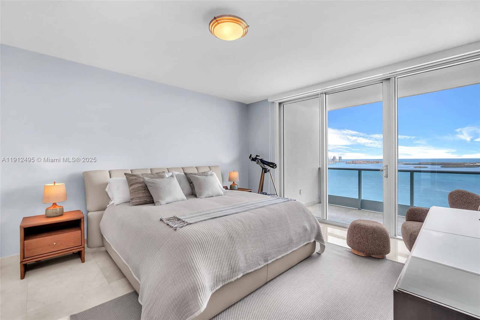 1331 Brickell Bay Drive, Unit 3609 Miami, FL 33131 - Photo 18 of 35 a bedroom with bed and a window