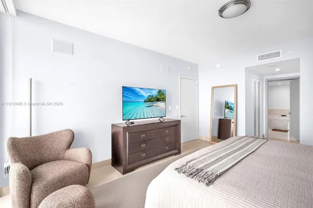 a bedroom with furniture and a window