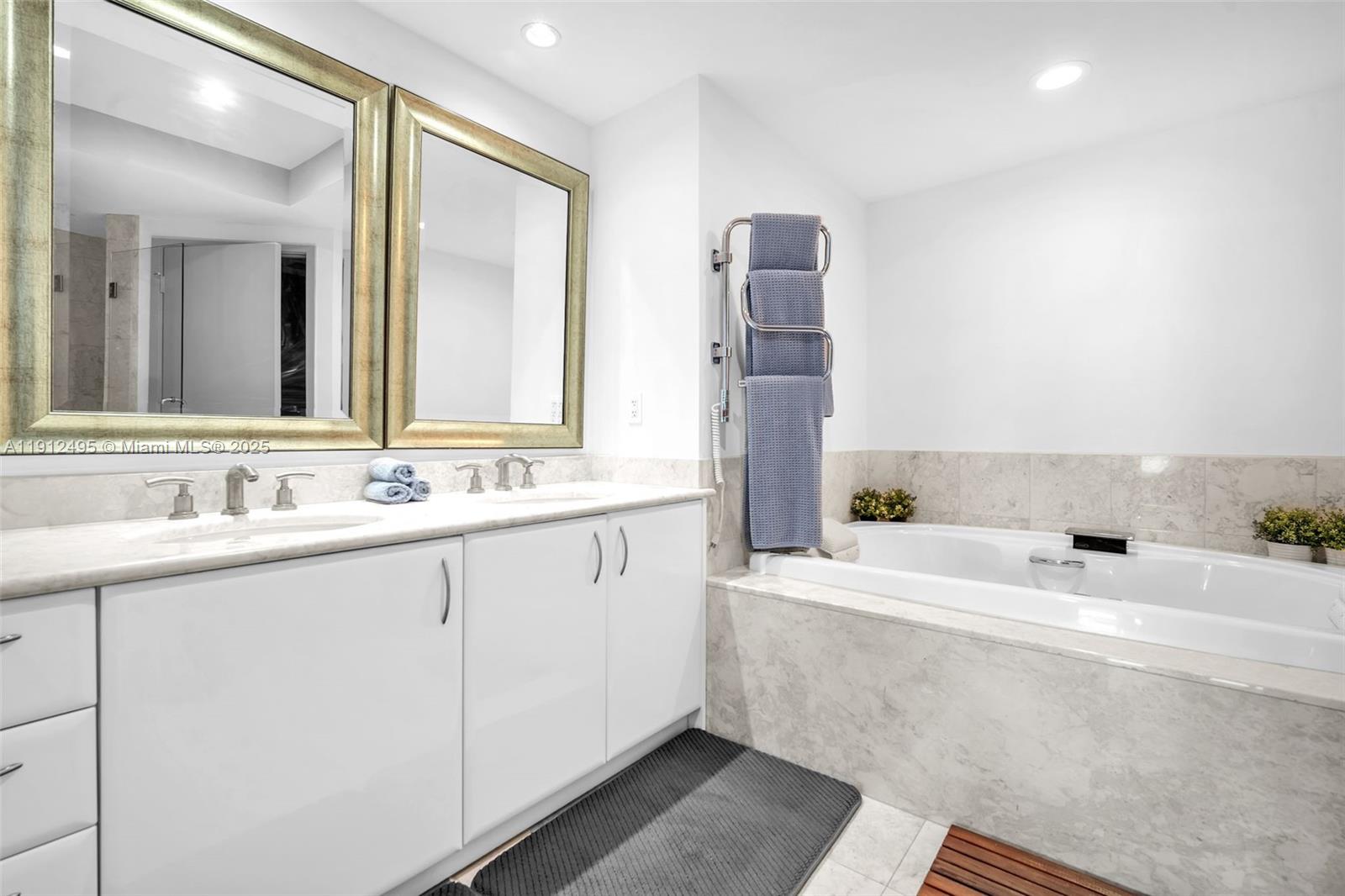 1331 Brickell Bay Drive, Unit 3609 Miami, FL 33131 - Photo 21 of 35 a bathroom with a sink and a mirror