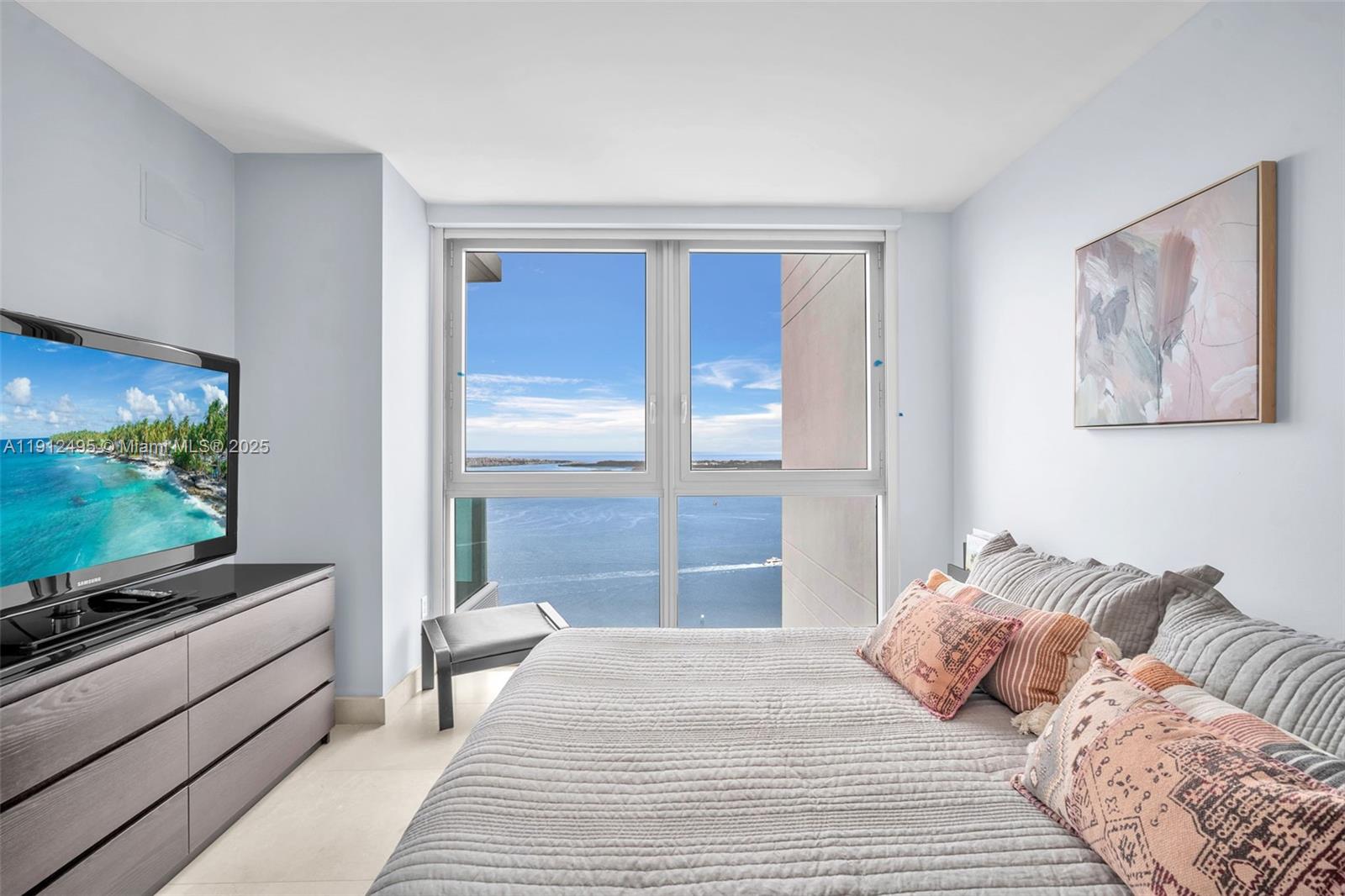 1331 Brickell Bay Drive, Unit 3609 Miami, FL 33131 - Photo 26 of 35 a bedroom with a bed and a flat screen tv