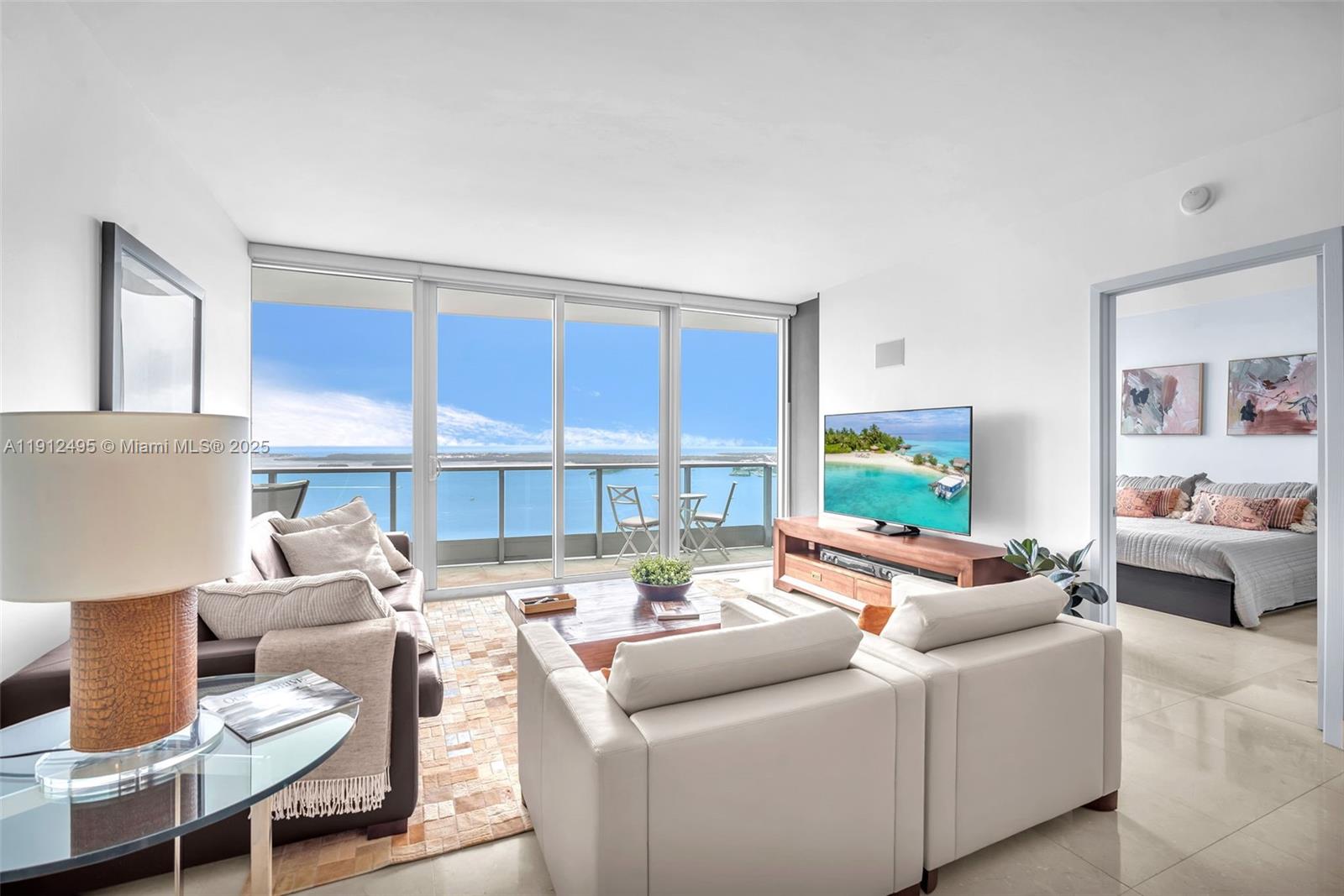 1331 Brickell Bay Drive, Unit 3609 Miami, FL 33131 - Photo 7 of 35 a living room with furniture and a large window