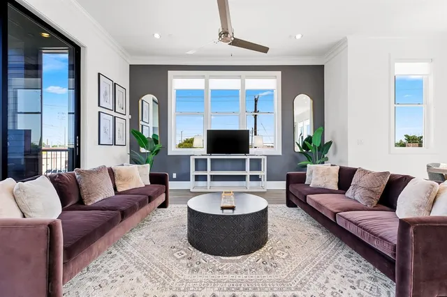 a bedroom with a bed couch and window