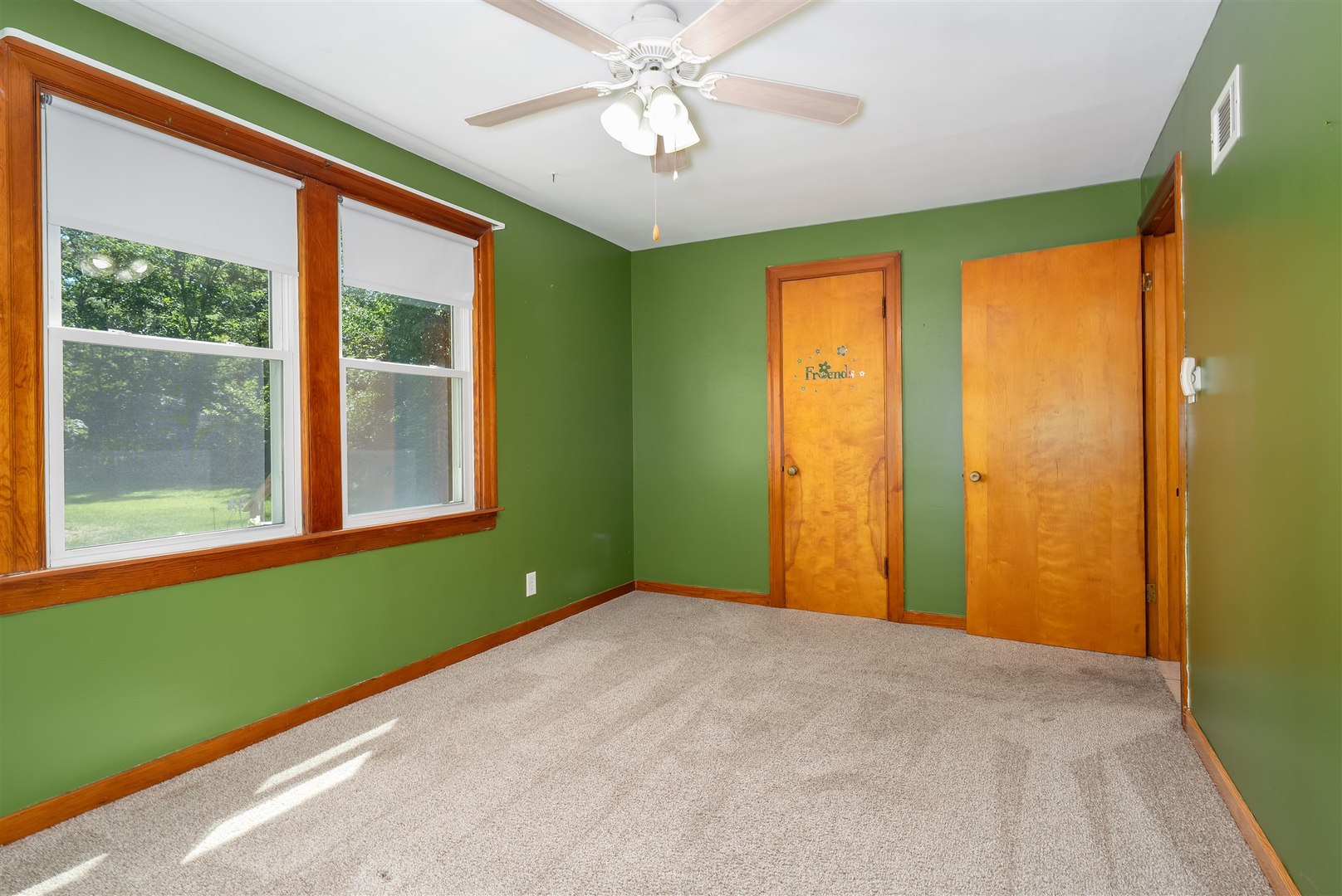 19097 1330 E Road Pontiac, IL 61764 - Photo 11 of 48 a view of an empty room with a window and a ceiling fan