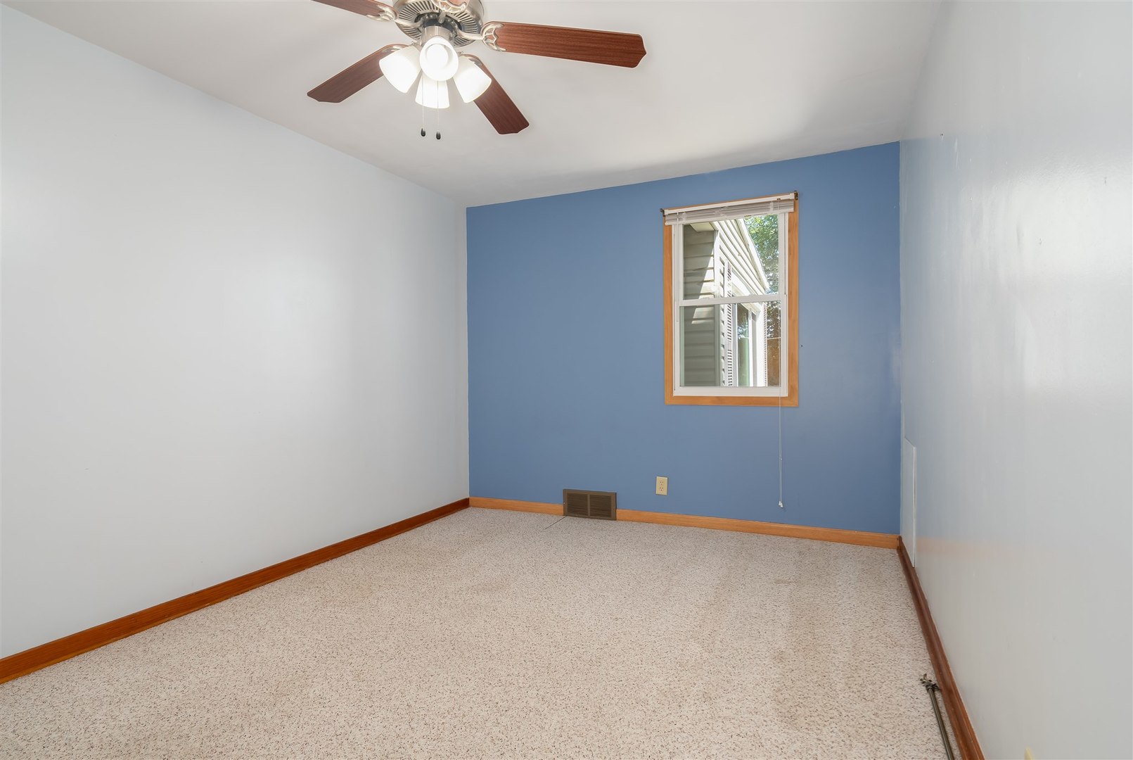 19097 1330 E Road Pontiac, IL 61764 - Photo 13 of 48 an empty room with a window and a ceiling fan