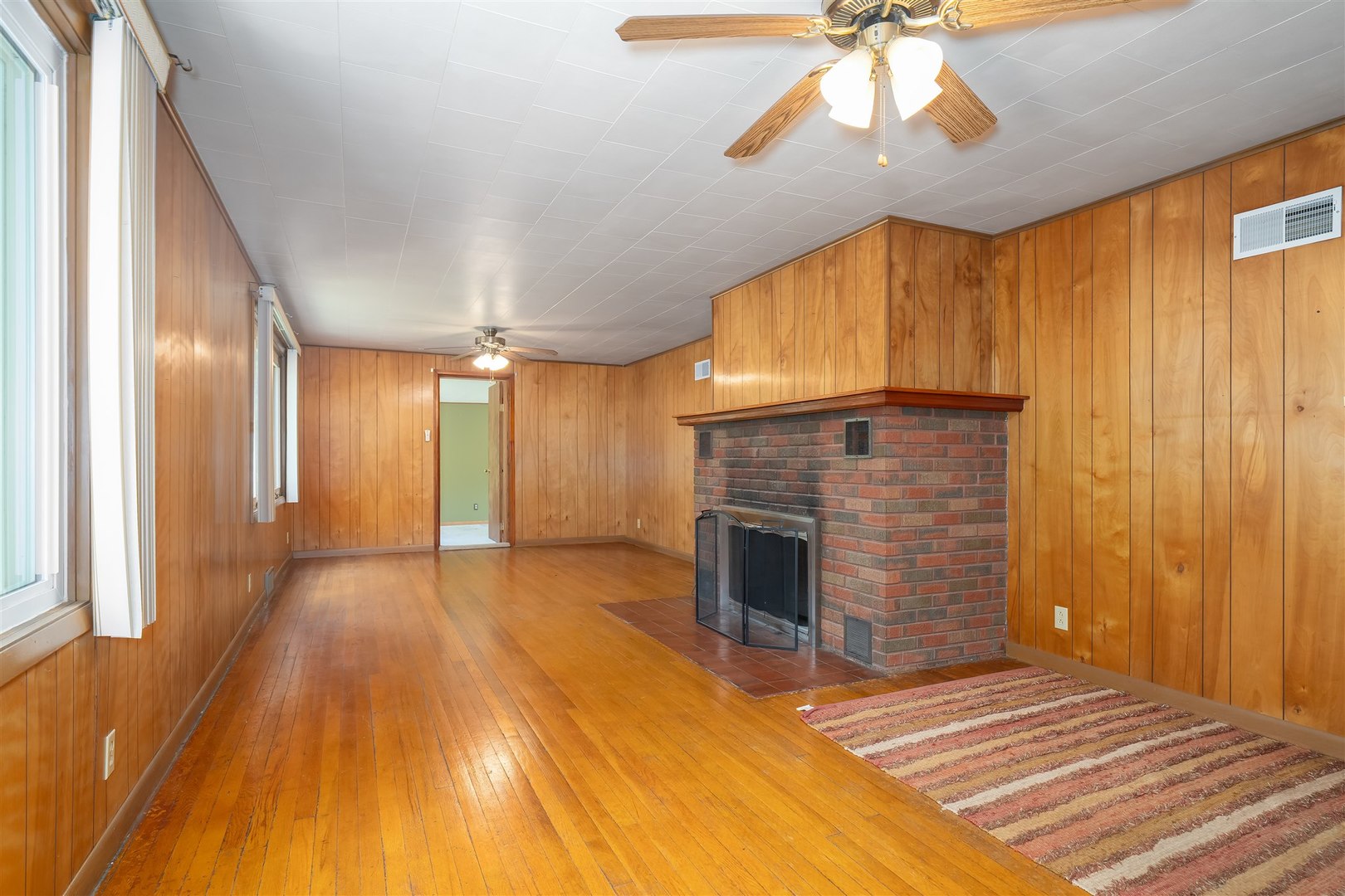 19097 1330 E Road Pontiac, IL 61764 - Photo 16 of 48 a spacious bedroom with a bed and a fireplace