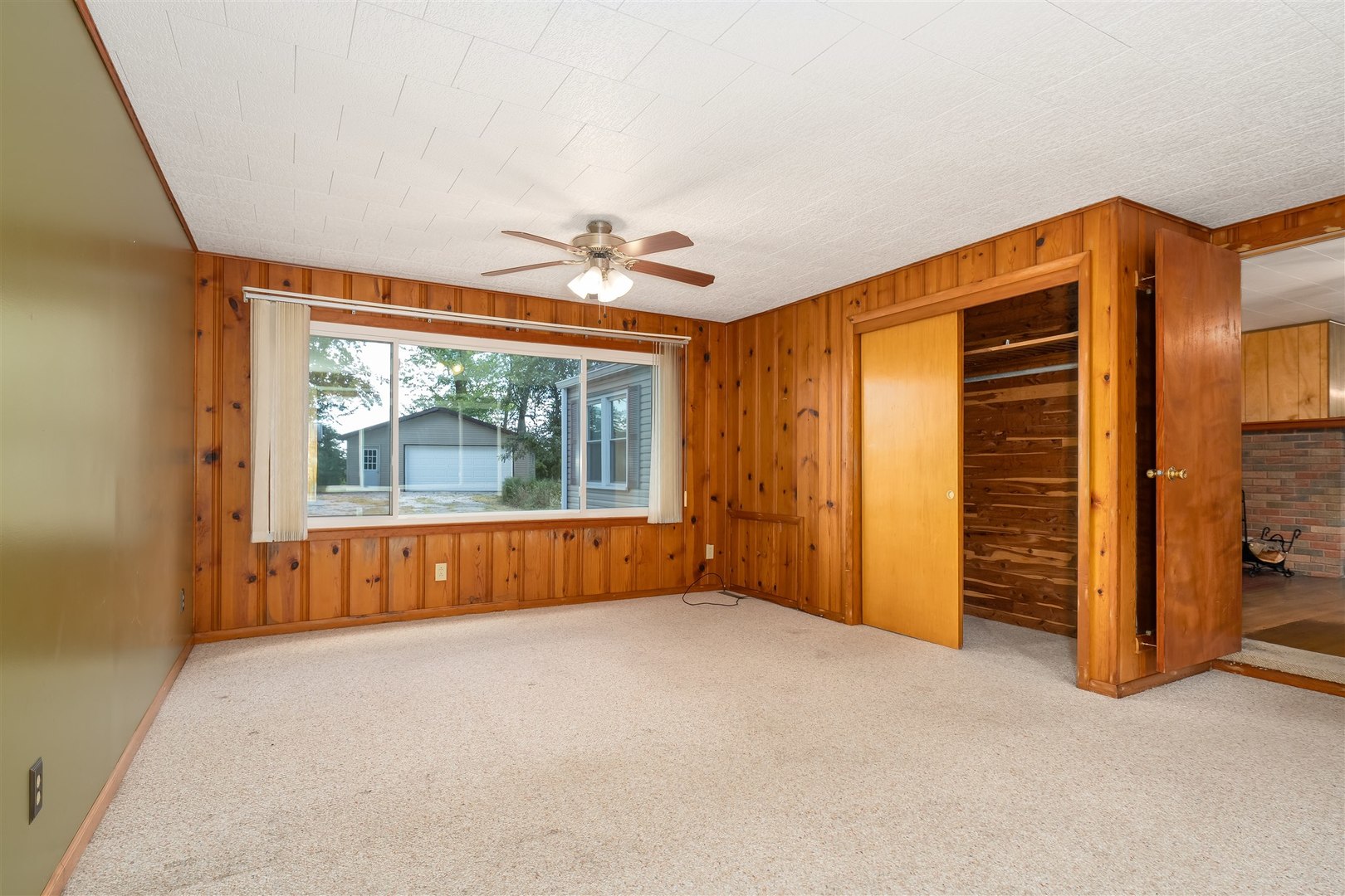 19097 1330 E Road Pontiac, IL 61764 - Photo 18 of 48 a view of empty room with wooden floor and fan
