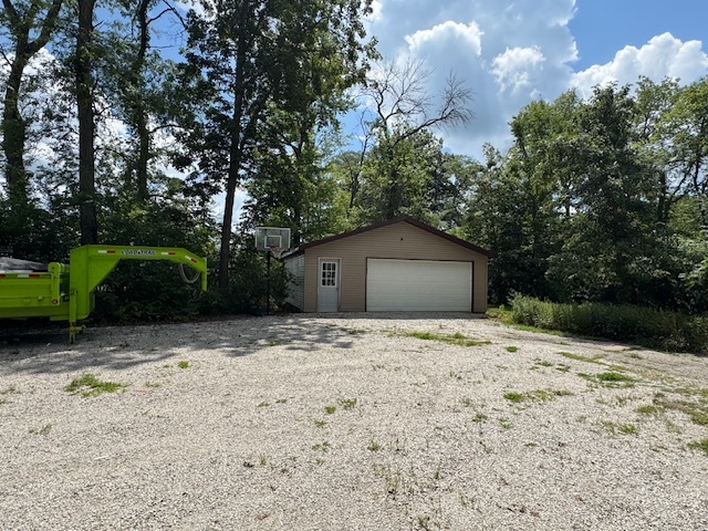19097 1330 E Road Pontiac, IL 61764 - Photo 2 of 48 a house with trees in front of it