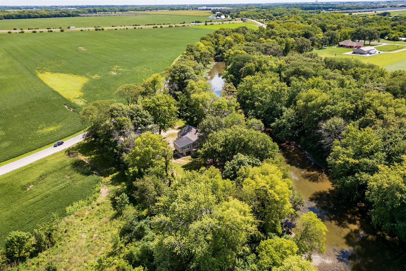 19097 1330 E Road Pontiac, IL 61764 - Photo 45 of 48 a view of a lake with a city