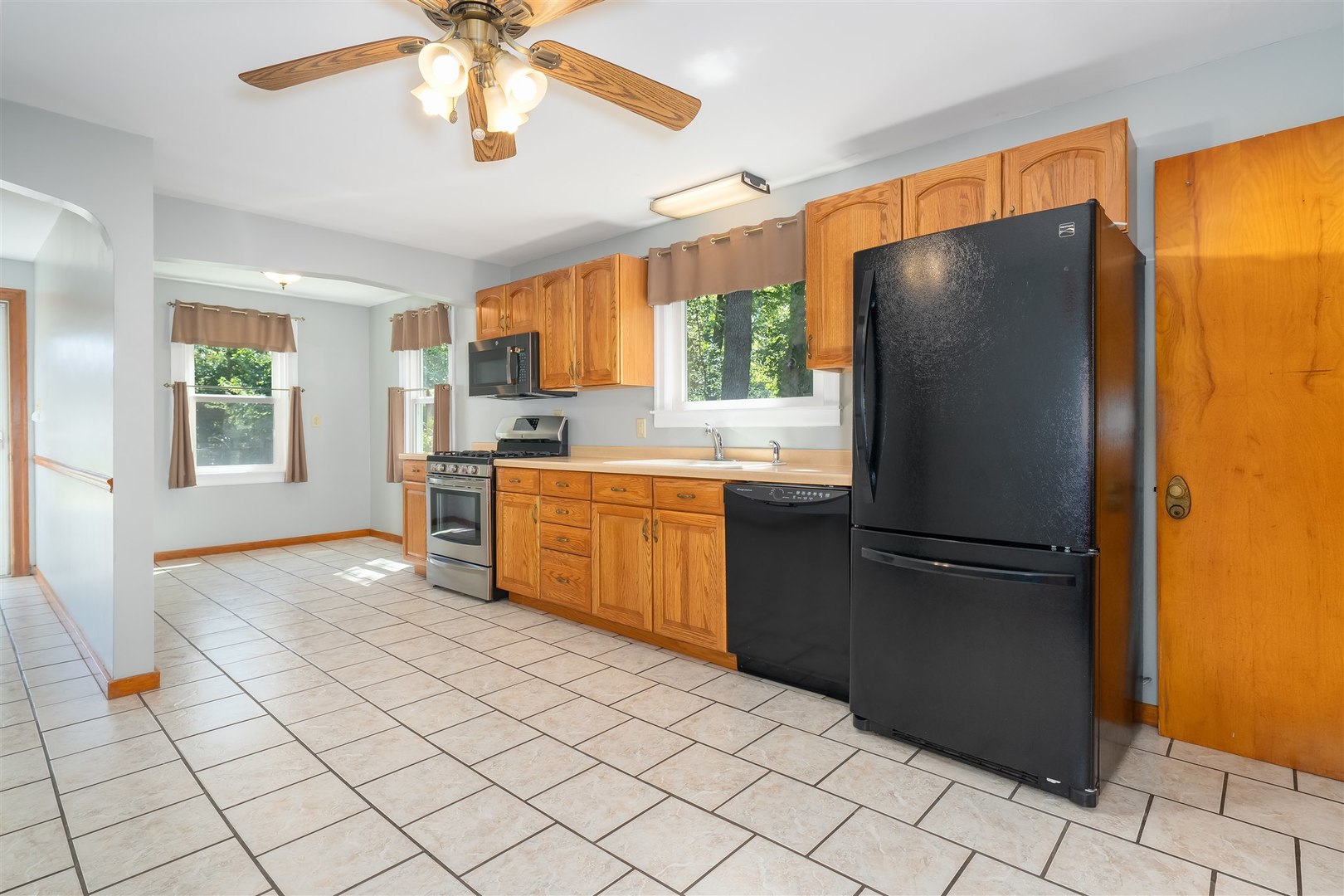 19097 1330 E Road Pontiac, IL 61764 - Photo 7 of 48 a kitchen with stainless steel appliances granite countertop a refrigerator sink and cabinets