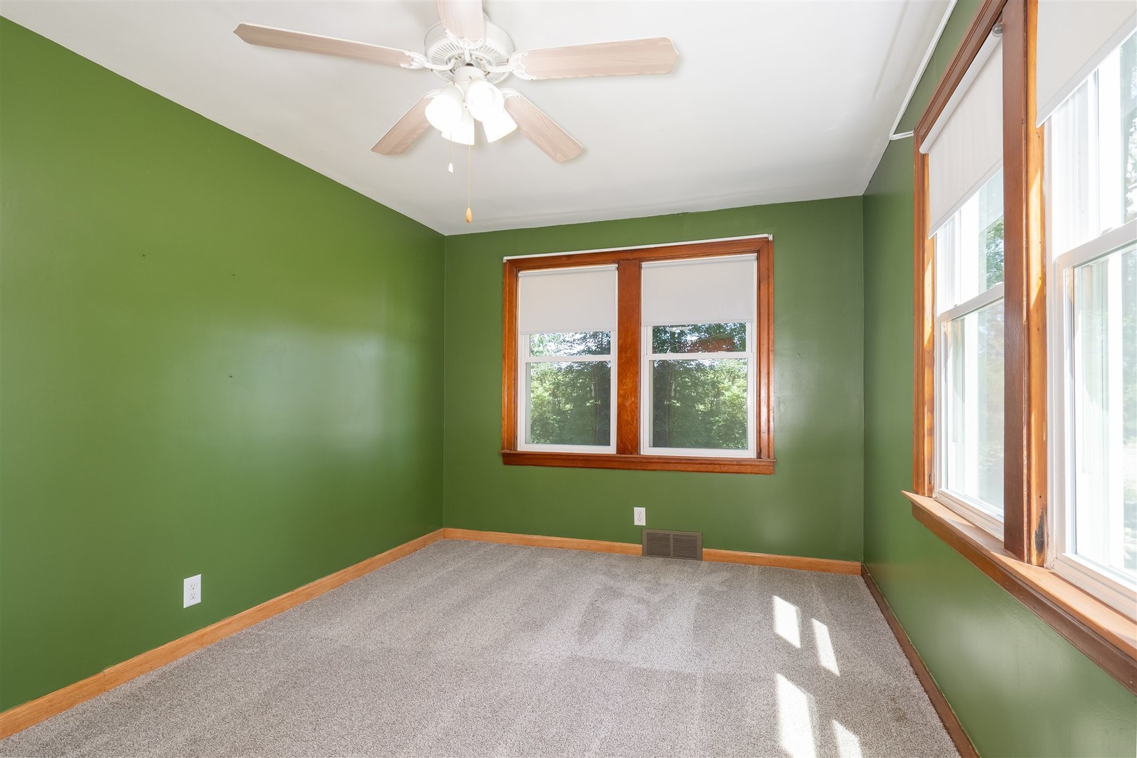 19097 1330 E Road Pontiac, IL 61764 - Photo 10 of 48 a view of an empty room with a window and a fan
