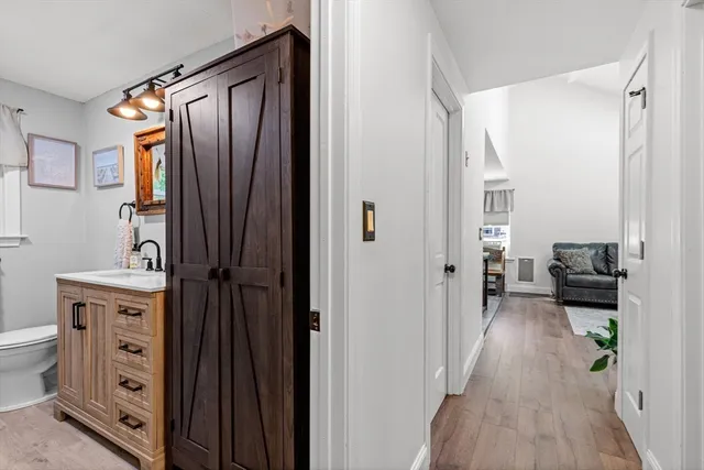 a view of a hallway with living room and furniture