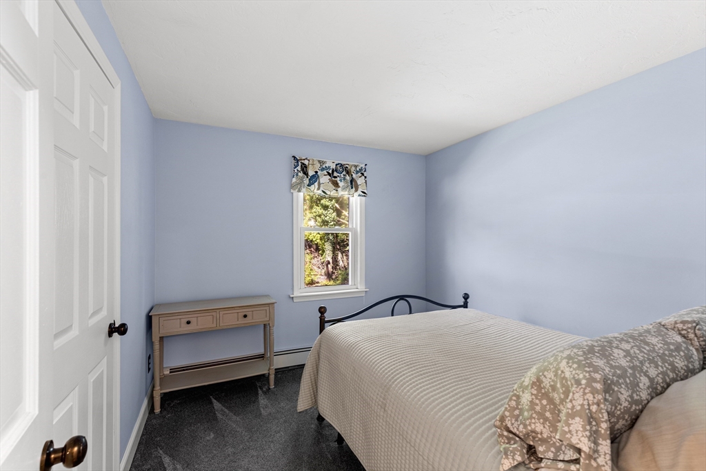 901 Head Of The Bay Road Bourne, MA 02532 - Photo 16 of 20 a bedroom with a bed and a window