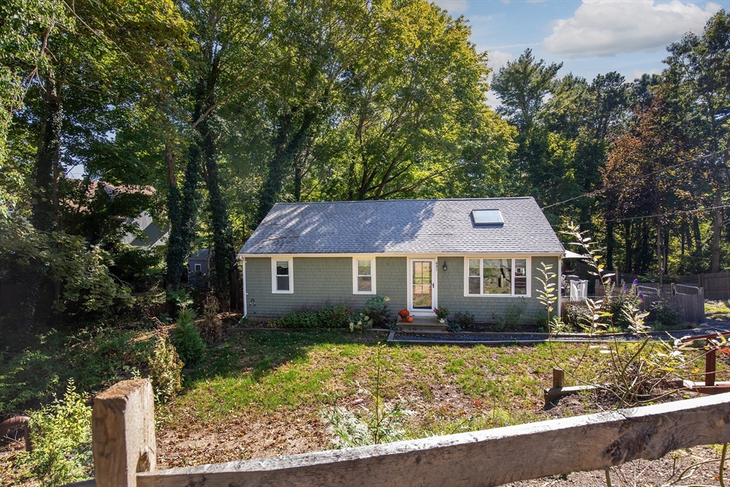 901 Head Of The Bay Road Bourne, MA 02532 - Photo 2 of 20 front view of house with a yard
