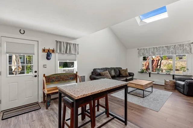 a living room with furniture and a table