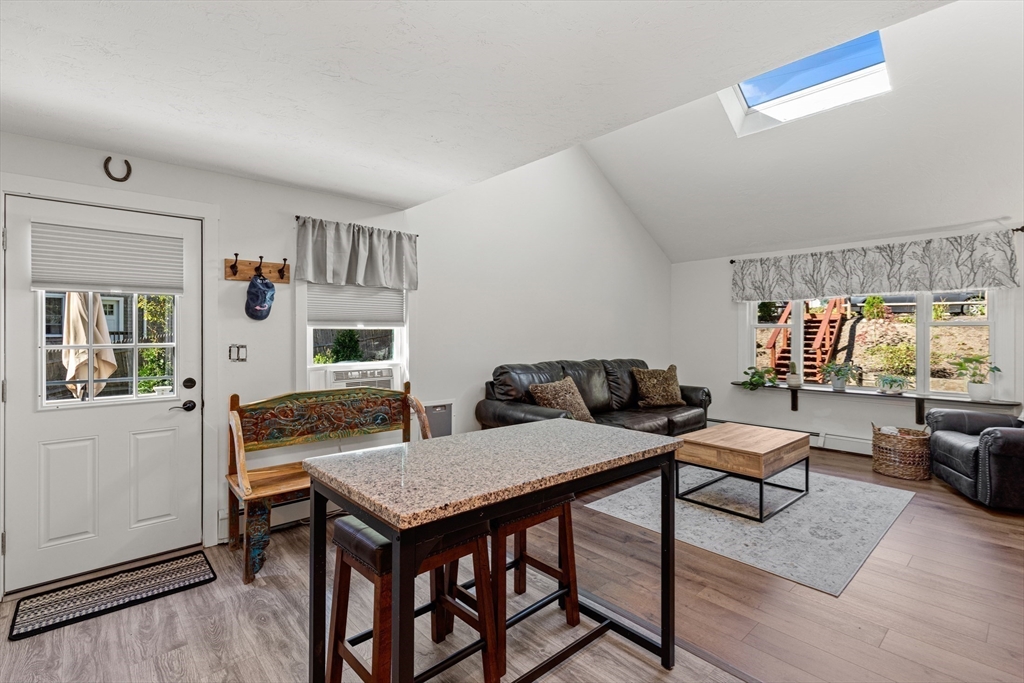 901 Head Of The Bay Road Bourne, MA 02532 - Photo 7 of 20 a living room with furniture and a table