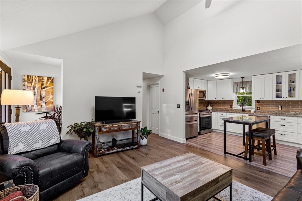 901 Head Of The Bay Road Bourne, MA 02532 - Photo 8 of 20 a living room with furniture and a flat screen tv