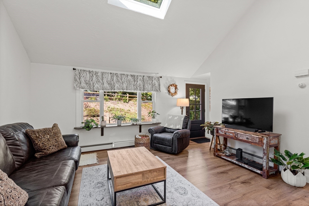 901 Head Of The Bay Road Bourne, MA 02532 - Photo 9 of 20 a living room with furniture and a flat screen tv